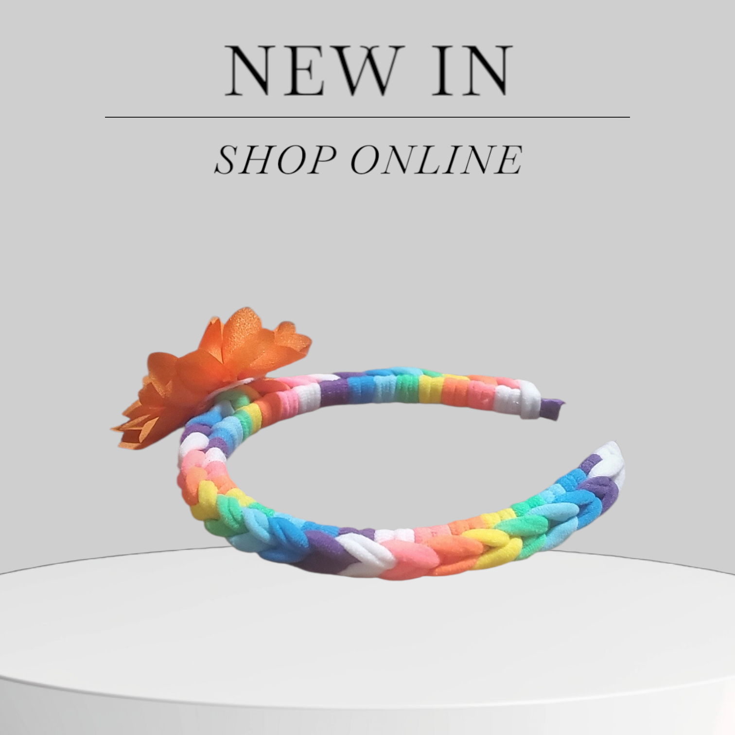 Multicolor Headband with Orange Floral Accent