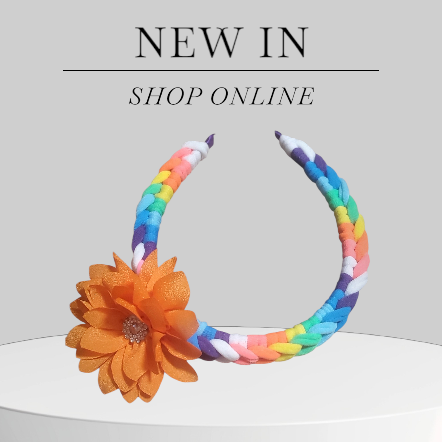 Multicolor Headband with Orange Floral Accent