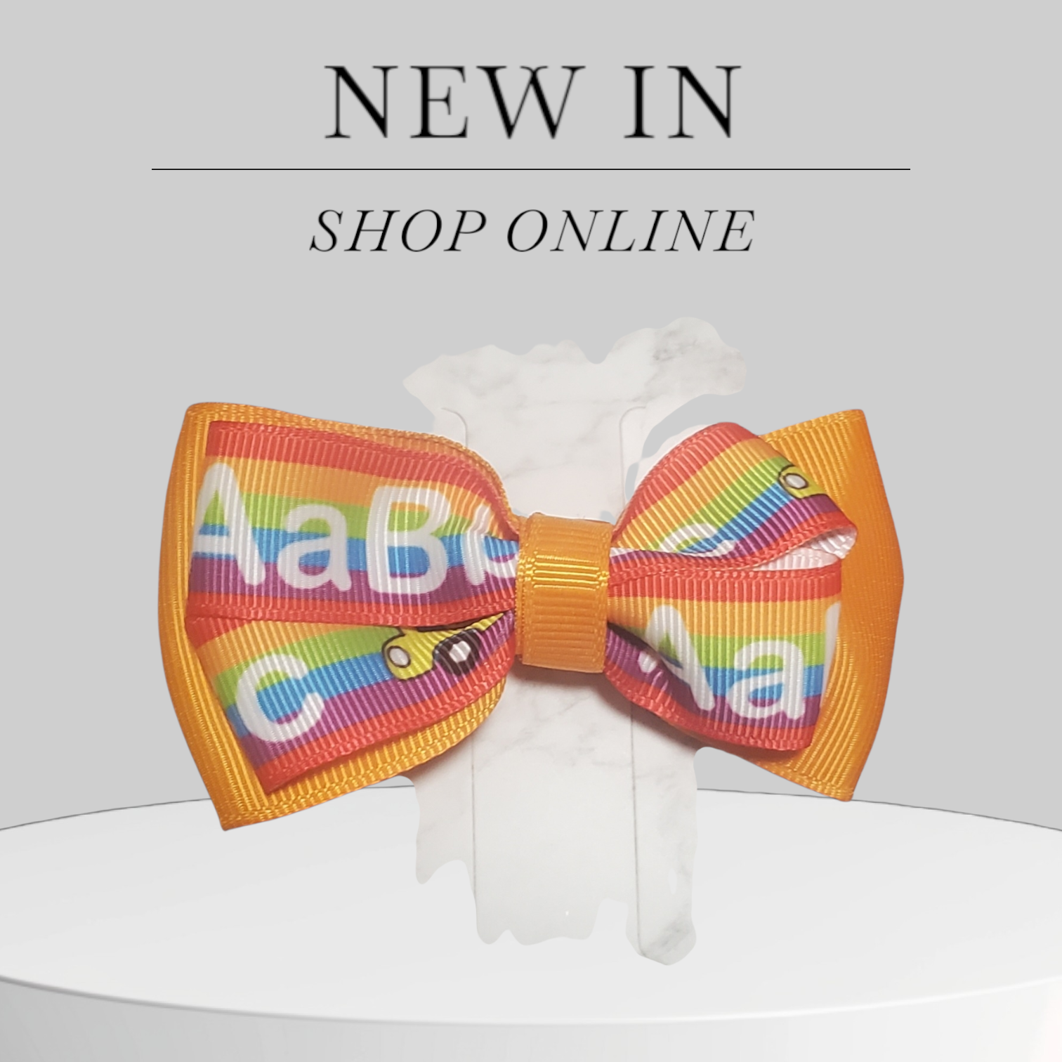 Orange Hair Bow with Vibrant Alphabet Ribbon Accent